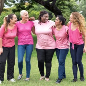 Women in pink at perimenopause or menopause ages